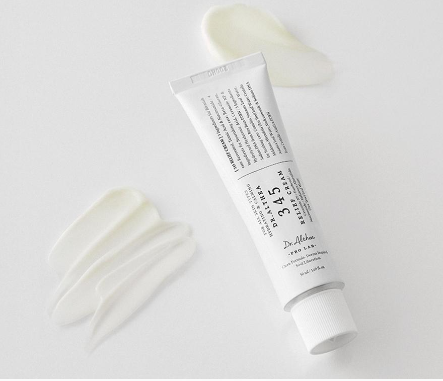 Dr. Althea 345 Relief Cream tube placed next to smooth swatches of moisturizing white cream texture
